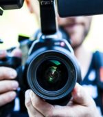 camera held by photographer