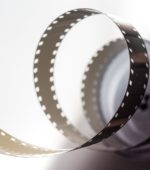 35mm film curling out of a film canister