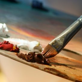 oil paints and a brush on a palette