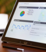 laptop with business figures