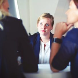 boss discussing issues with two workers