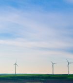 wind turbines on top of a hill