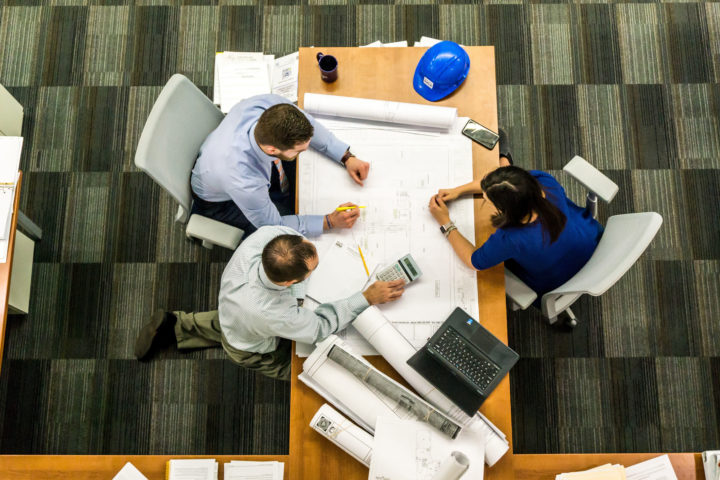 Architectural and Engineering Managers reviewing plans