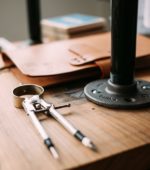 compass and design tools on desk
