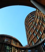 inside a curved architectural building, looking up