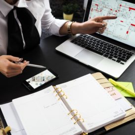 designer showing plans to client