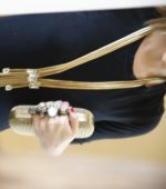 woman wears statement necklace