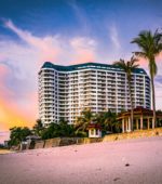 hotel on a tropical beach at sunset
