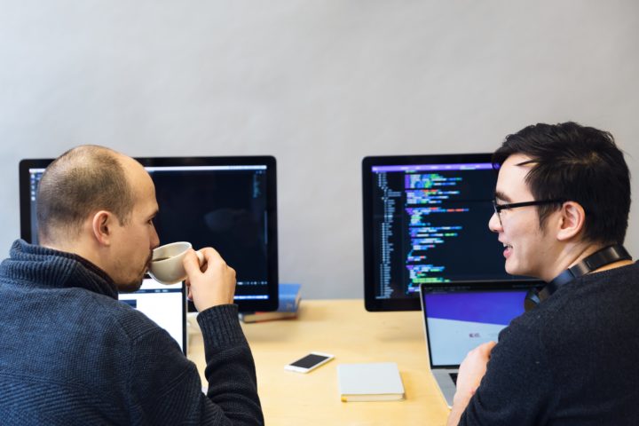 developers-discussing-javascript-code