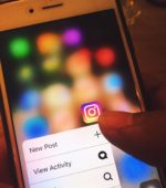 customer looks at app on phone