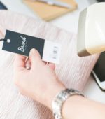 cashier scans barcode on clothing item