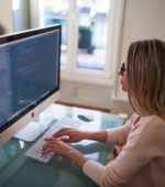woman typing into computer