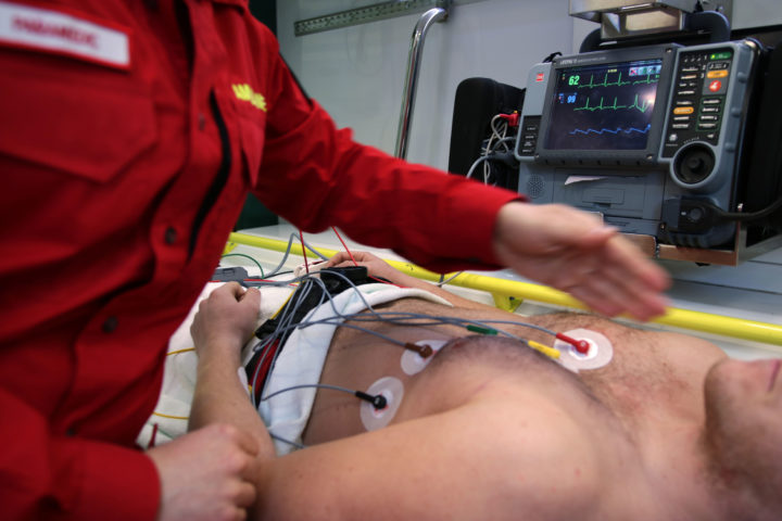 Emergency Medical Technician and Paramedic adminsters help to patient