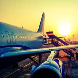 sunset against the side of an airplane