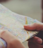hand holding a printed map